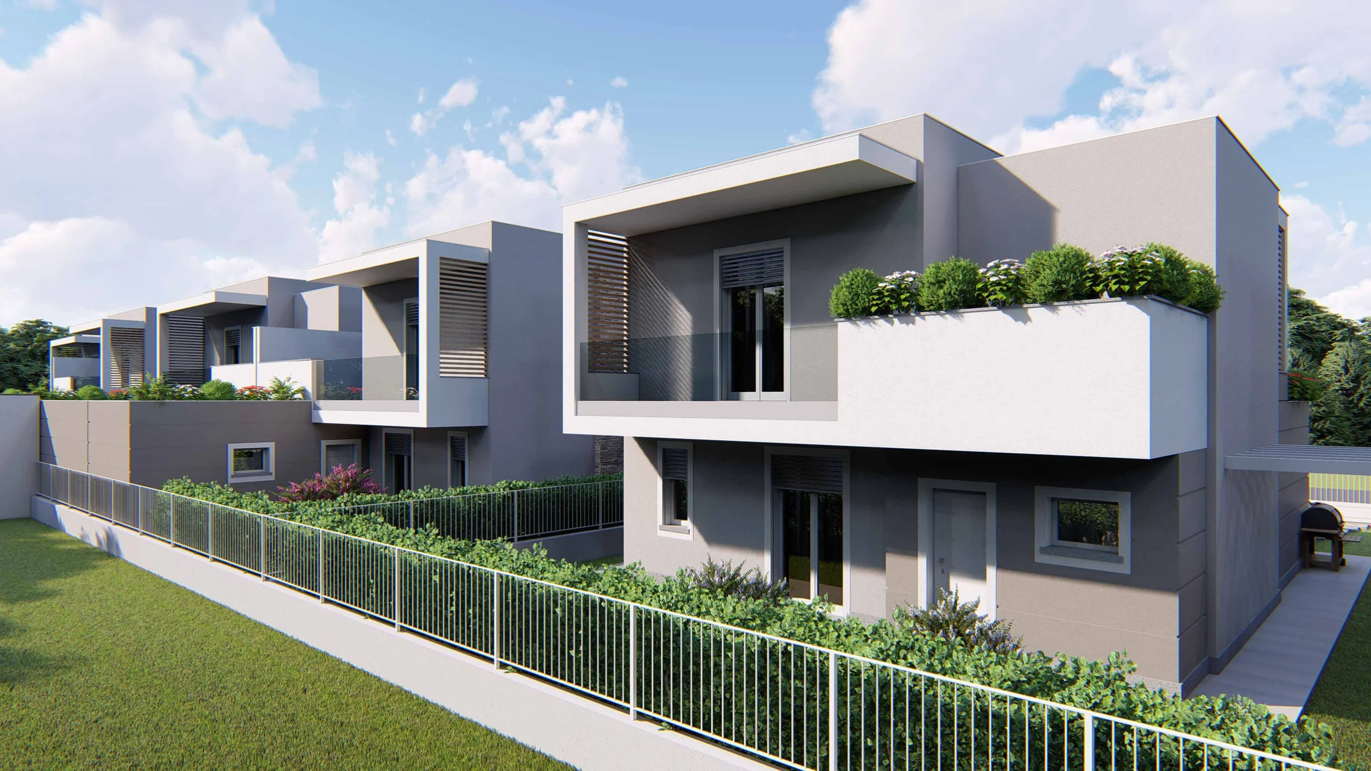 Rendering di una villa vista dal prato oltre la recinzione: loggia al piano superiore con parapetto in vetro accanto a una grande fioriera bianca con arbusti, finestre e ingresso al piano terra; dietro, le altre ville