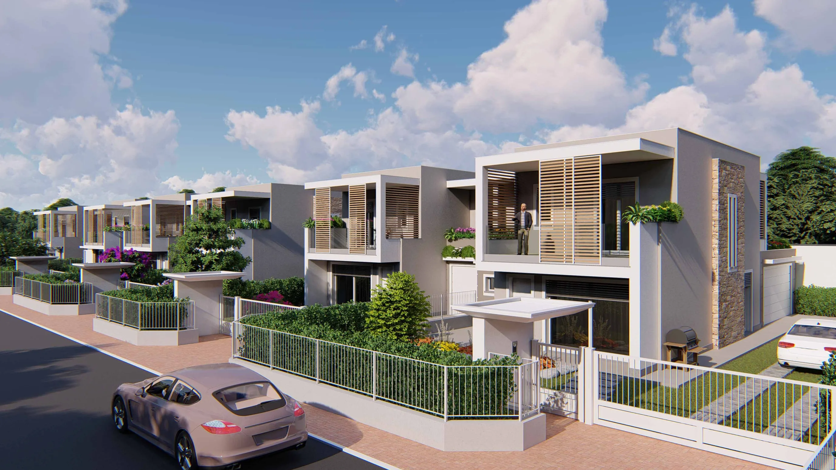 Rendering dalla strada verso la fila delle ville: in primo piano una villa con loggia al piano superiore schermata da frangisole color legno, fascia in pietra sul fianco, ingresso pedonale con pensilina e cancello carraio verso il box; un’auto sulla strada